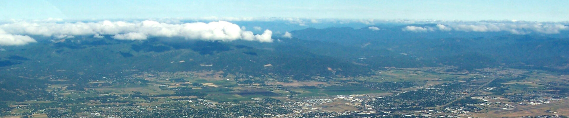 Photo Credit: An aerial image of Medford Oregon via Wikimedia. Author: Little Mountain 5